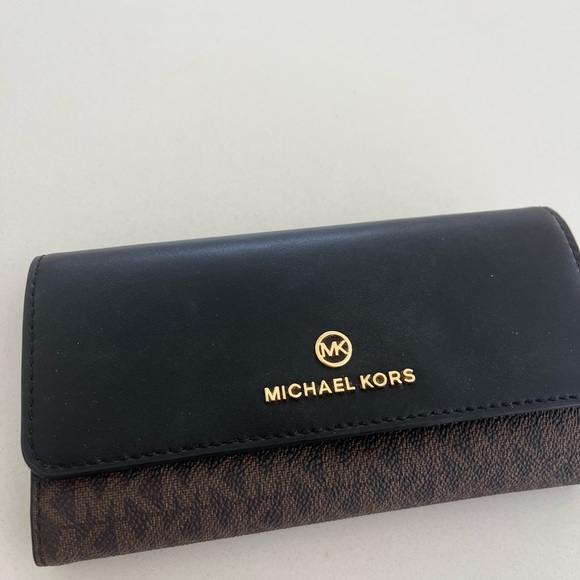Michael Kors Black and Brown Logo Wallet
Trifold. - Picture 6 of 6